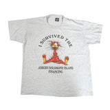 Gray t-shirt with cartoon character and text on a white background