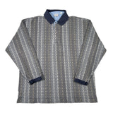 Gray patterned shirt with blue collar and cuffs on a white background