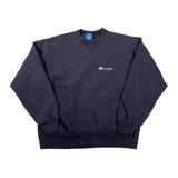 A dark navy Champion crewneck sweatshirt with a small embroidered Champion logo on the left chest, laid flat on a white background.