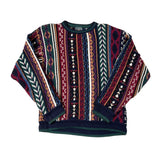 Multicolored patterned sweater on a white background