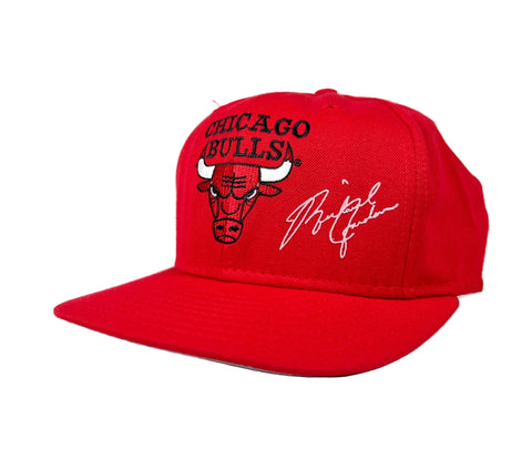 Red Chicago Bulls cap with signature on a white background