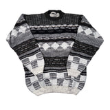 Black and white patterned sweater on a white background