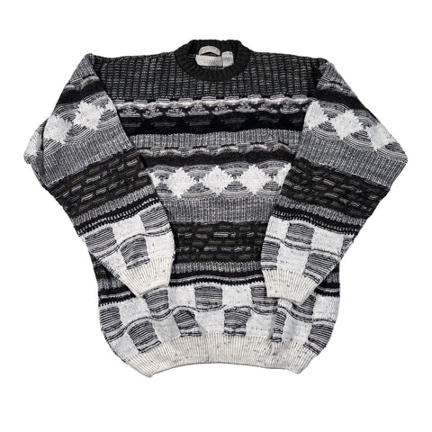 Black and white patterned sweater on a white background