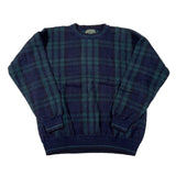 Plaid sweater with a visible brand label on a white background