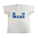 White t-shirt with blue 'Ducks' text on a white background