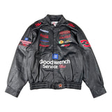 Black jacket with various brand logos on a white background