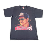 Vintage t-shirt with a graphic of a driver and text on a white background