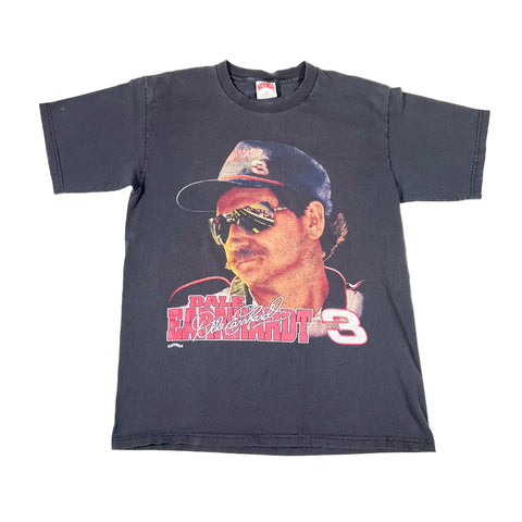 Vintage t-shirt with a graphic of a driver and text on a white background