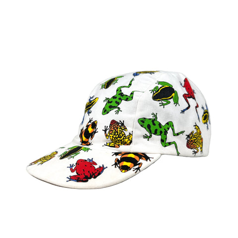 White cap with colorful frog pattern on a gray background