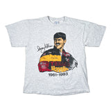 A light heather gray short-sleeve graphic T-shirt laid flat on a white surface. The front features a large printed portrait of Dale Earnhardt with his signature and the text 'Texas Hayabusa 1961-1993' over red, yellow, and black graphics.