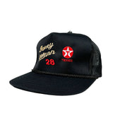Black trucker cap with embroidered text and logo on a white background