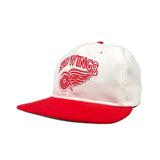White and red cap with 'Red Wings' logo on a white background
