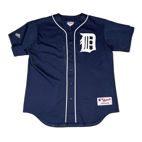 Navy blue baseball jersey with a white logo on a white background