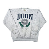 A heather gray crewneck sweatshirt featuring a navy blue 'DOON' arch graphic and a green and gray Iowa seal on the front, laid flat on a white background.