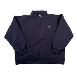 Folded navy blue jacket on a white background