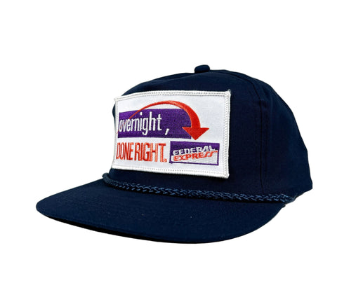 Navy blue cap with a Federal Express logo on a white background