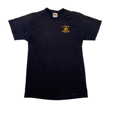 Black t-shirt with a logo on the chest against a white background