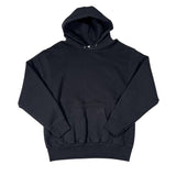 Black outfit with ruffled details on a white background