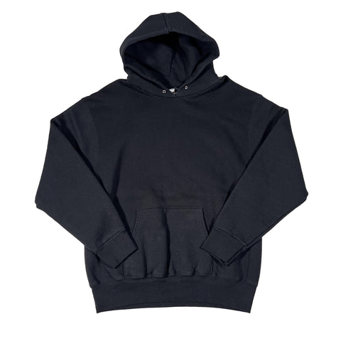 Black outfit with ruffled details on a white background