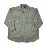 Green shirt with rolled-up sleeves on a white background