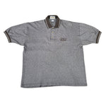 Gray polo shirt with a GT BMX logo on a white surface