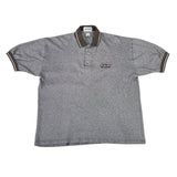 Gray polo shirt with a GT BMX logo on a white surface