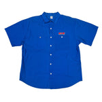Blue work shirt with a GT Bicycles logo on a white surface