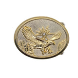 Gold belt buckle with an eagle design on a white background