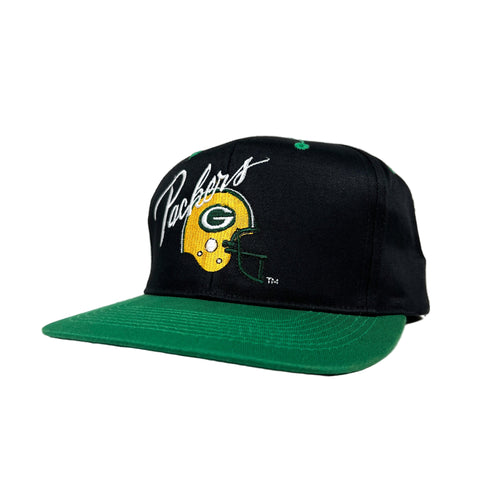 Black and green cap with Packers logo on a white background