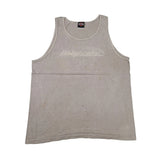 A light brown tank top with 'Harley-Davidson' printed across the chest in a light-colored script, laid flat on a white surface.