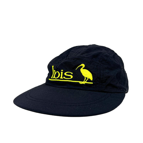Black cap with yellow 'Ibis' logo on a white background
