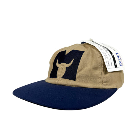 Beige and navy cap with a logo on a white background