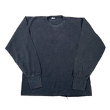 A faded black ribbed knit crewneck sweater laid flat on a white background.