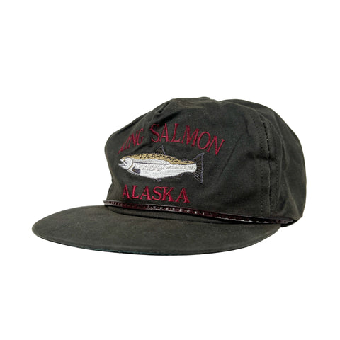 Black cap with salmon design and 'Alaska' text on a white background