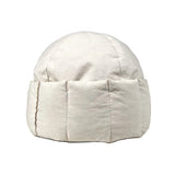 White bean-shaped ottoman on a gray background