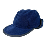 A navy blue fleece winter cap with a curved brim and a matching fleece ear flap, photographed on a clean white background.