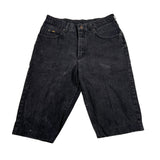 Pair of black denim shorts on a white background