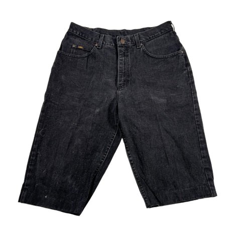 Pair of black denim shorts on a white background