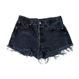 Black denim shorts with frayed edges on a white background