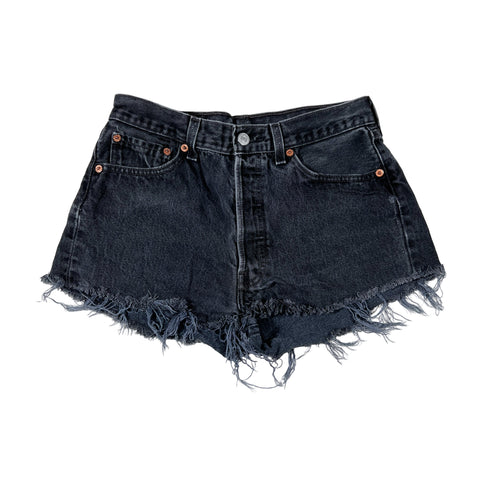 Black denim shorts with frayed edges on a white background