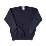 Black shorts with a brand label on a white background