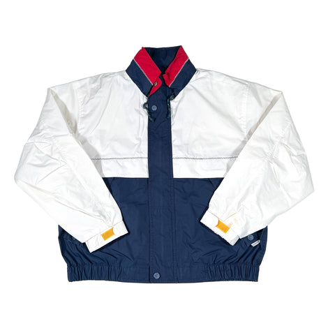 White and navy jacket with red collar on a white background