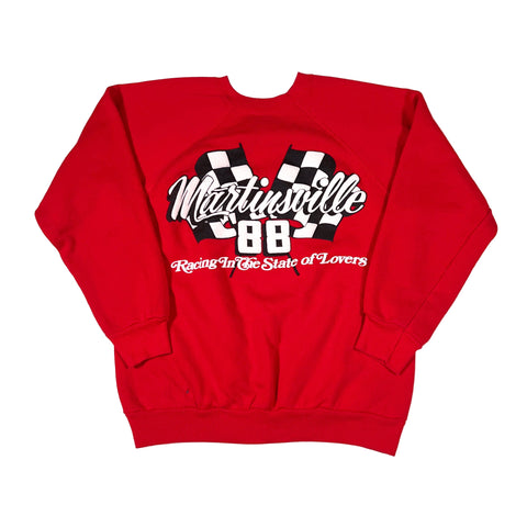 Red sweatshirt with text and checkered design on a white background