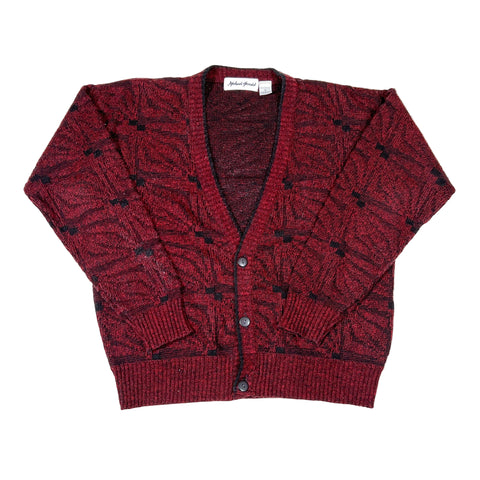 Red patterned cardigan on a white background