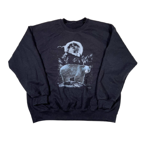Black sweatshirt with a graphic of a person and bear on a white background