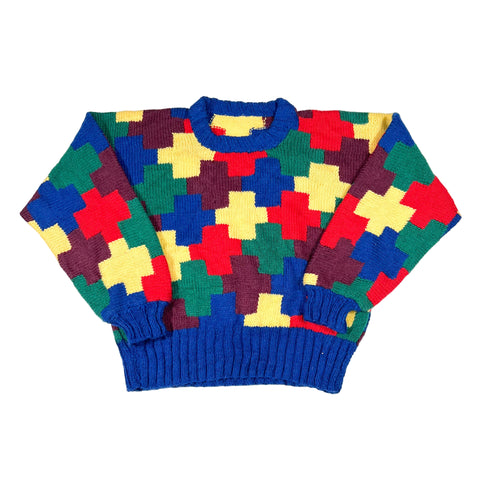 Colorful patterned sweater on a white background