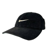 Black cap with a gold swoosh logo on a white background
