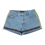 Blue denim shorts with floral embroidery on a white background