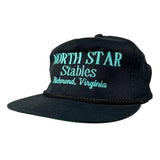 A black snapback cap with turquoise embroidered text reading 'NORTH STAR Stables Richmond, Virginia' on the front, shown on a plain light background.