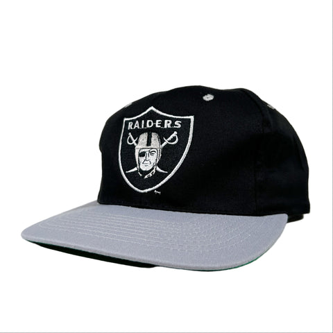 Black cap with Raiders logo on a white background